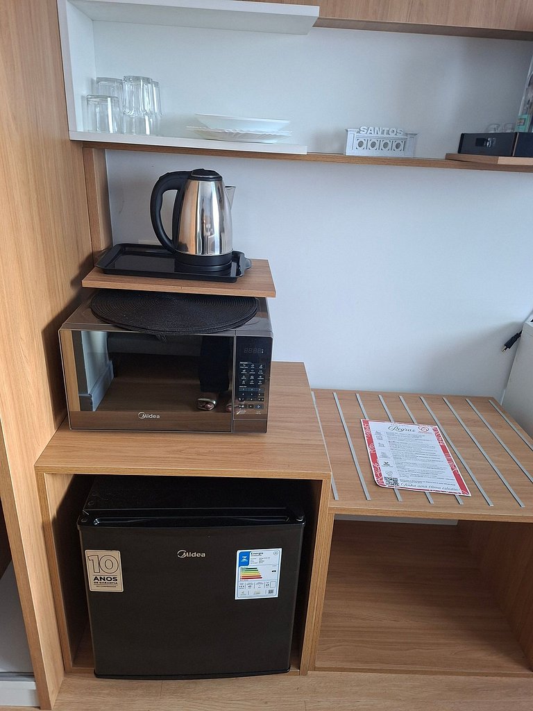 Flat na quadra da praia com cama queen!